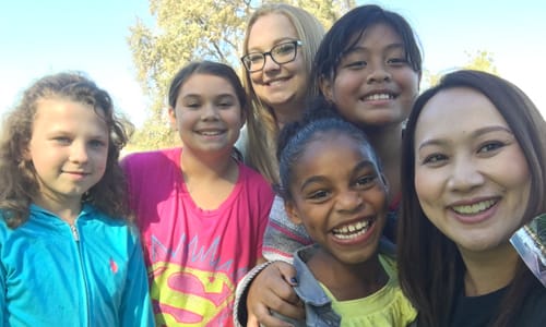 Kids smiling at the camera after exercising