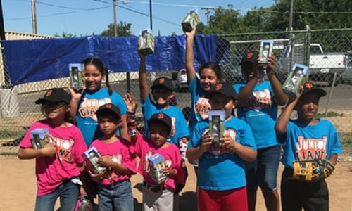 Kids holding up trophies