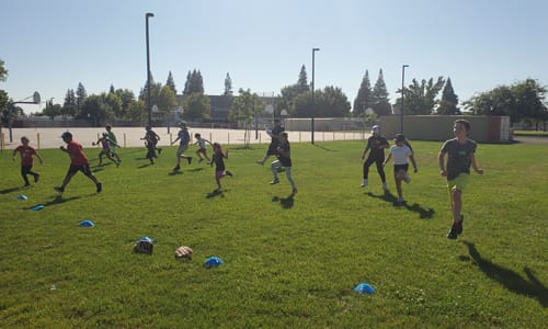 Kids running in grass