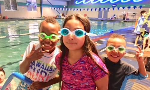 Kids smiling at the pool