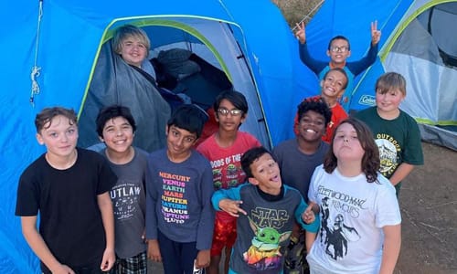 Group of kids camping outdoors