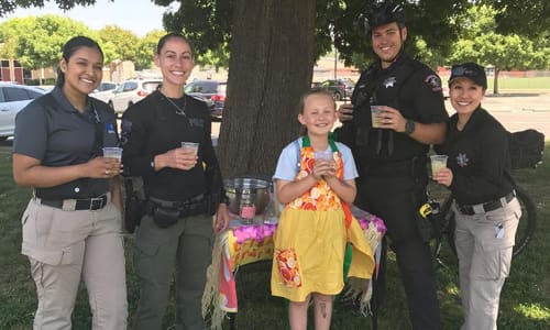 RCPD enjoying lemonade at little girl lemonade stand